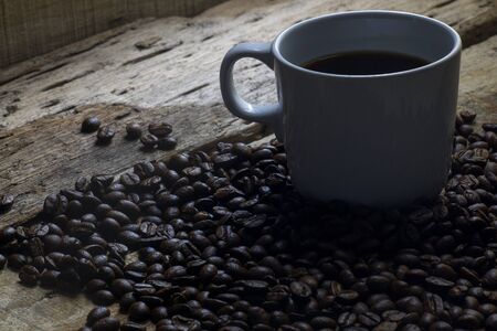 Coffee beans and espresso on wood backgroundの写真素材