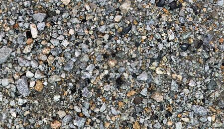 Scree Surface Decoration Top View Background. Stone Details of Pebbles on the walkway. Gray Concrete Stone Texture Construction Material. Natural Rock Pattern Closeup. Pebble Ground Grunge Wet Outdoorの写真素材