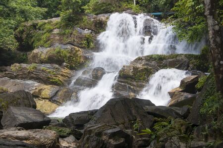 waterfall in thai national park. In the deep forest on mountain.の写真素材