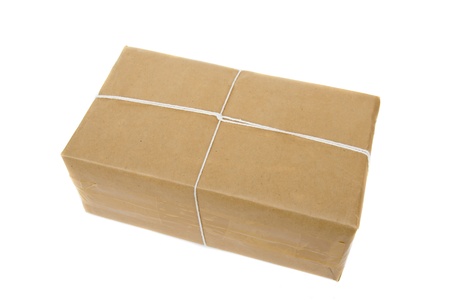 parcel box with kraft paper, isolated on white backgroundの写真素材