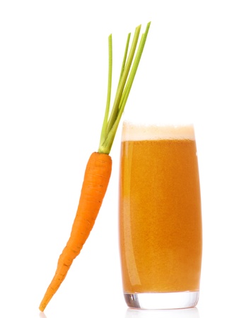 Carrot juice and slices of carrot isolated on whiteの写真素材