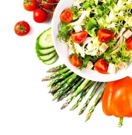 cabbage broccoli with tomatoes and green leaves isolated on white backgroundの写真素材