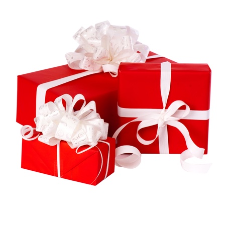 Pillar of boxes with presents wrapped in red paper, isolated on whiteの写真素材