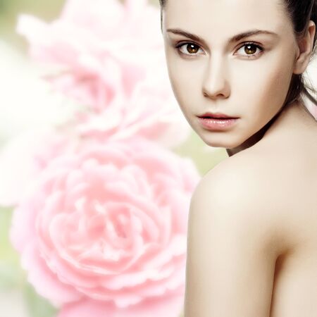 Beautiful young woman with clean skin of the face  Pretty female posing on white backgroundの写真素材
