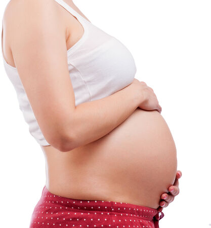 Close up of a cute pregnant bellyの写真素材
