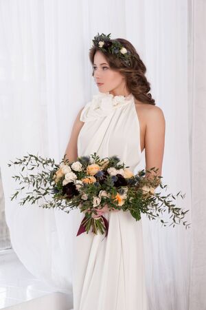 Wedding. Young Gentle Quiet Bride in Classic White Veil Looking Awayの写真素材
