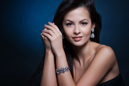 Beautiful woman with evening make-up. Jewelry and Beauty. Fashion photoの写真素材
