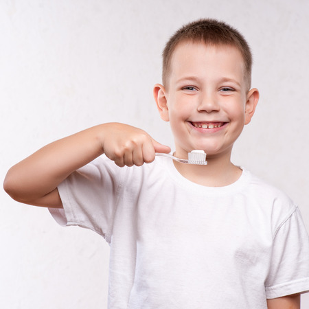 Young boy brushing his teethの写真素材
