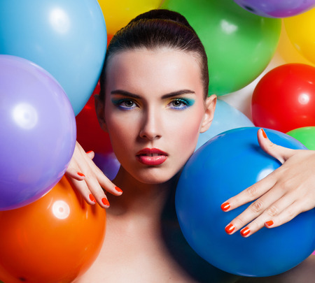Beauty Girl Portrait with Colorful Makeup, Nail polish and Accessories. Colourful Studio Shot of Funny Woman. Vivid Colors.の写真素材