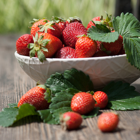 tasty summer fruits on a wooden tableの写真素材