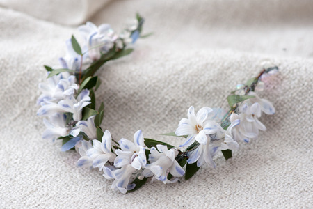 tiara of artificial roses on wooden background.の写真素材