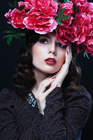 Beautiful girl with flowers in her hair. Spring.の写真素材