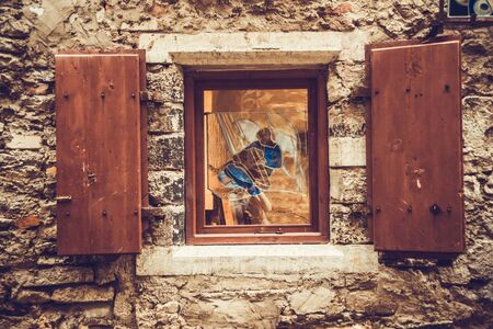 vintage brick wall background with old windowの写真素材