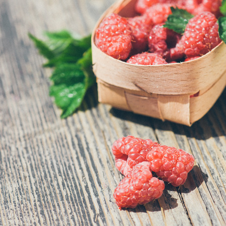 tasty summer fruits on a wooden tableの写真素材