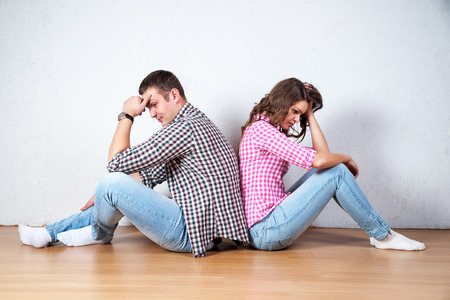 Couple sitting with their backs turned after having an argumentの写真素材