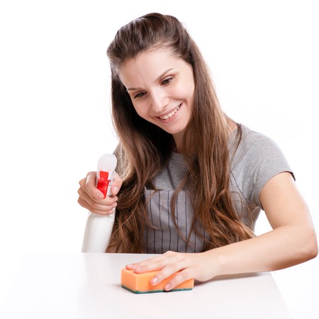 Woman Cleaning Surface In Kitchen. Isolatedの写真素材