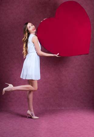 Elegant and fashion woman holding heartの写真素材