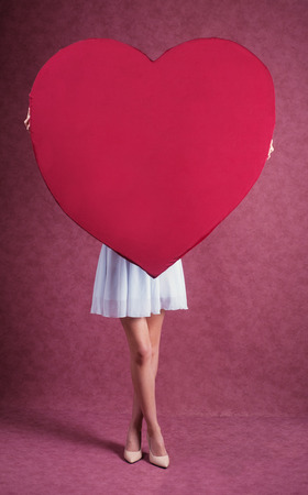 Elegant and fashion woman holding heartの写真素材