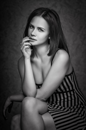Emotional portrait of young beautiful pretty girl. Stylish fashion dramatic portraitの写真素材
