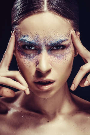Face of woman with beautiful makeup close-up.