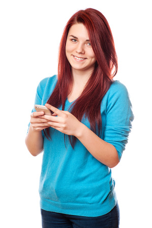 Beautiful young hipster woman using smart phoneの写真素材