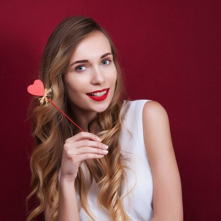 Elegant and fashion woman holding heartの写真素材