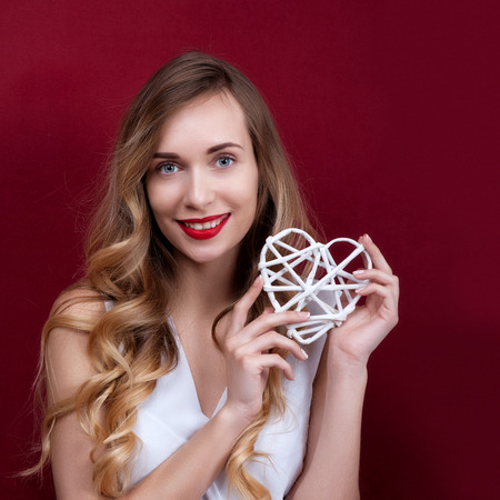 Elegant and fashion woman holding heartの写真素材