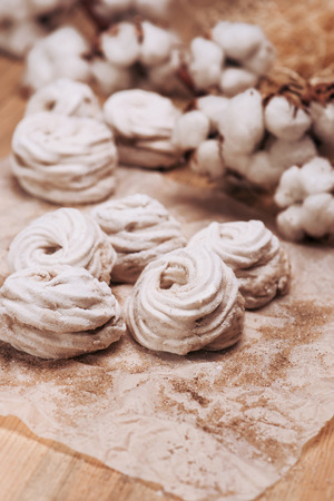 Homemade marshmallow Zephyr on a rustic wooden table.の写真素材
