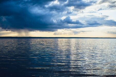 lake landscape with cloud reflections.の写真素材