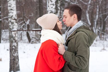Winter couple. Happy Couple Having Fun Outdoors. Snow. Winter Vacation. Outdoor .の写真素材