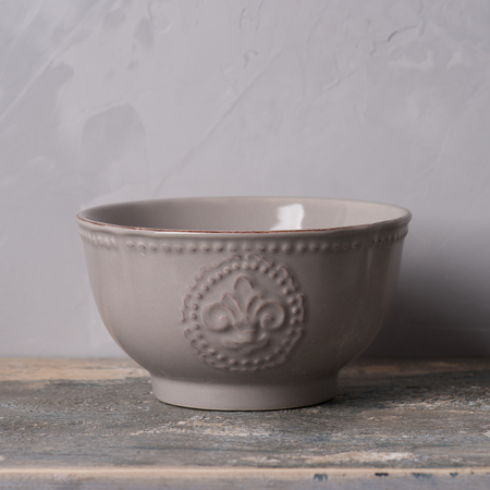 Vintage bowl on gray background.の写真素材