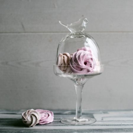 Homemade marshmallows in glass stand on a wooden background.の写真素材