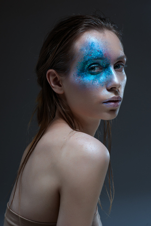 Beauty Woman with Perfect Makeup. Beautiful Professional Holiday Make-up. Purple Lips and Nails. Beauty Girl's Face .の写真素材
