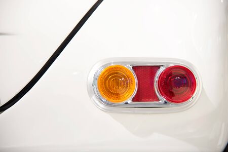Beautiful white car headlights. Close up photoの写真素材