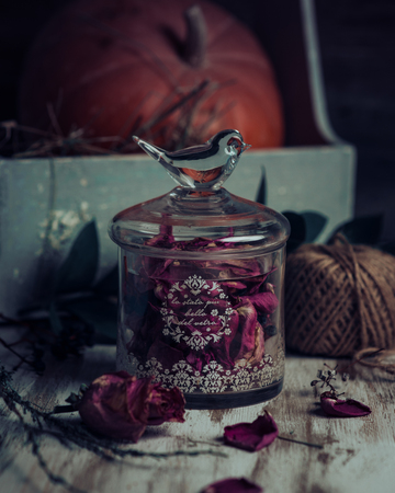 Rose buds tea, tea strainer and glass jar. Selective focus.の写真素材