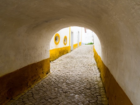 charming streets of old town Obidos in Portugal, artistic picture.の写真素材