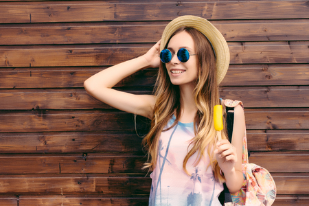 Cool hipster student woman wearing eyewear glasses . Caucasian female university student looking at camera smiling happyの写真素材