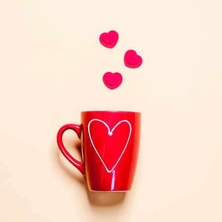 Cup of tea with heart teabag. Light backgroundの写真素材