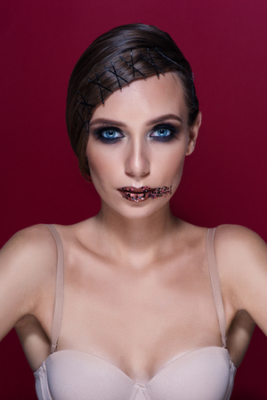 Beautiful Fashion Luxury Makeup, long eyelashes, perfect skin facial make-up. Beauty Brunette model woman holiday make up close up. Eyelash extensions, false eyelashes.の写真素材
