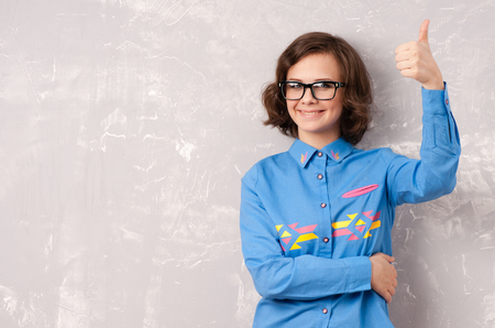 Cool hipster student woman wearing eyewear glasses . Caucasian female university student looking at camera smiling happyの写真素材