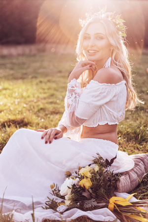 Bride. Boho bride with wreath on sunset outdoor. Boho style.の写真素材