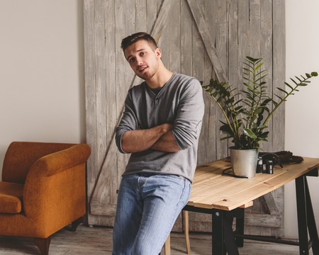 Portrait of sexy man indoor. Young Hipster man