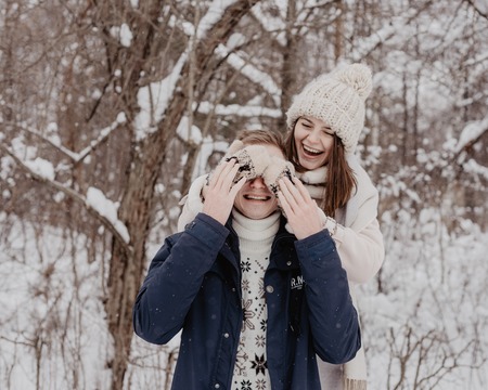 Happy Young Couple in Winter Park having fun.Family Outdoors. loveの写真素材