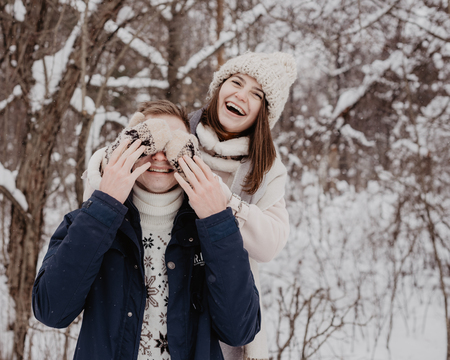Happy Young Couple in Winter Park having fun.Family Outdoors. loveの写真素材
