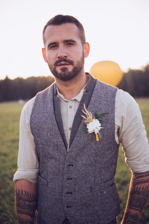 Portrait of stylish beard, male with tattoos on his arms. Wedding portrait.の写真素材