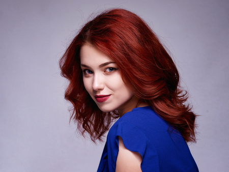 Woman with beauty long brown hair - posing at studio.の写真素材