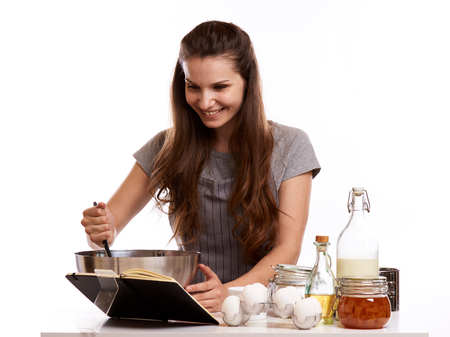 Portrait of beautiful chef home cook at home with dessert cupcakes homemade sweets.の写真素材