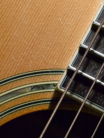 closeup shot of guitar and strings