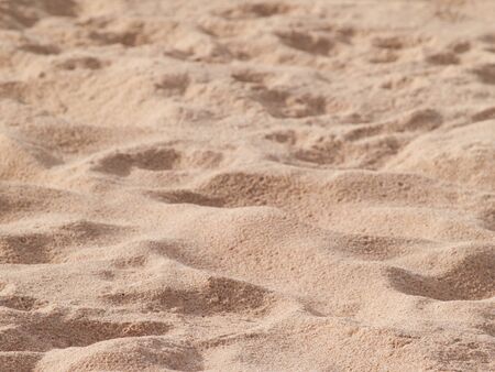 closeup of sand pattern of a beach in the summerの写真素材