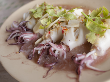 Steam squid with spicy chilli and lemon sauce.の写真素材